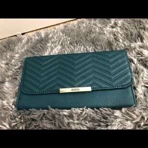 GUESS hunter green clutch